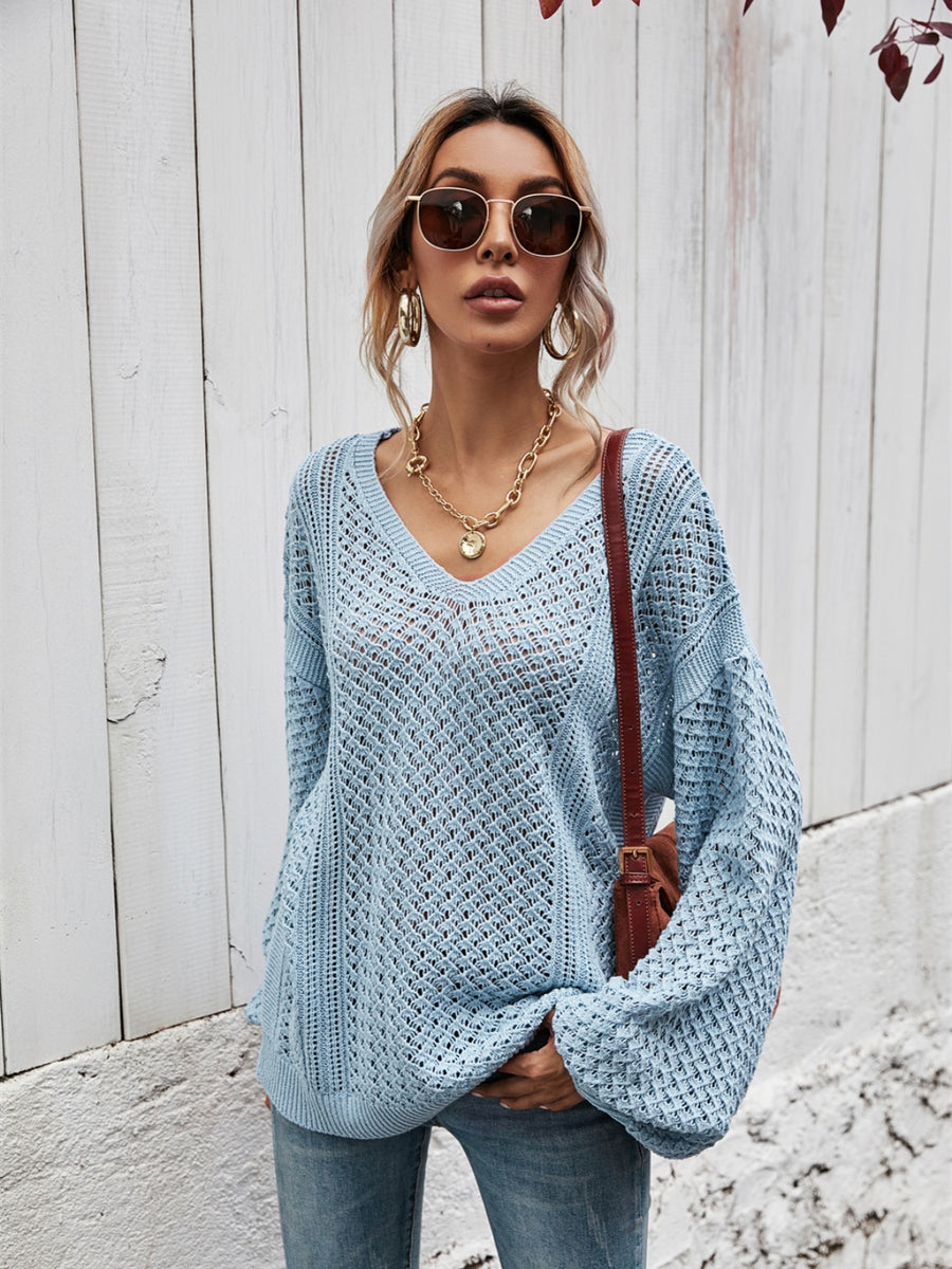 Open-knit sweater in Misty Blue with V-neck and balloon sleeves.