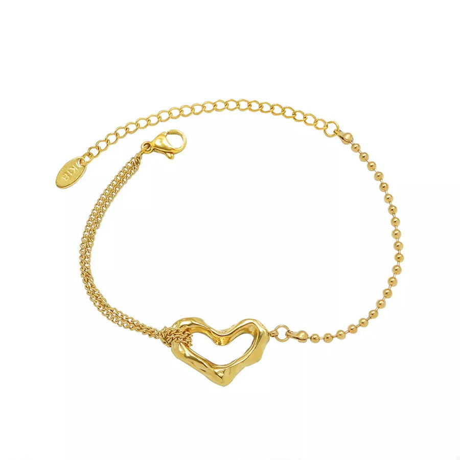 bracelet in gold with heart charm and wrist-length