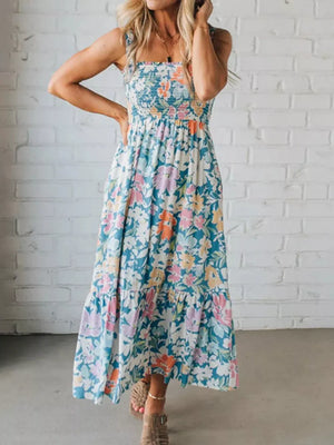 Maxi dress with smocked bodice and floral print, featuring a tiered hem.