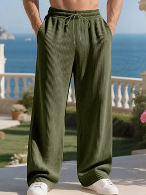 Men's military green drawstring sweatpants with a relaxed fit and ribbed texture.