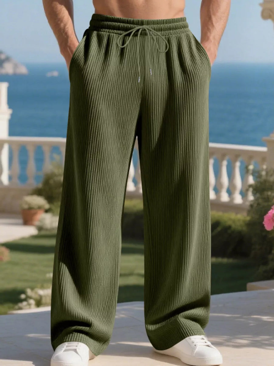 Men's military green drawstring sweatpants with a relaxed fit and ribbed texture.