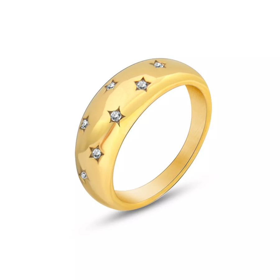 Gold dome ring with scattered star-shaped zircon accents.