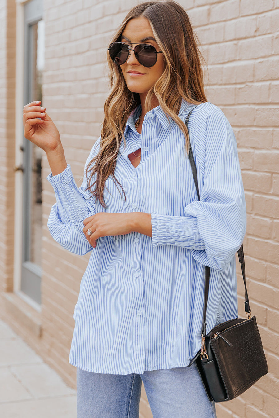 Pastel blue pinstripe blouse with balloon sleeves and smocked cuffs