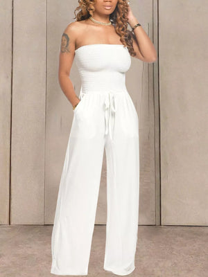White strapless smocked jumpsuit with wide legs and drawstring waist