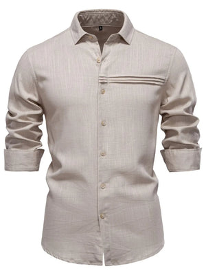 Light gray linen shirt with buttoned front, collar, and pleated pocket detail.