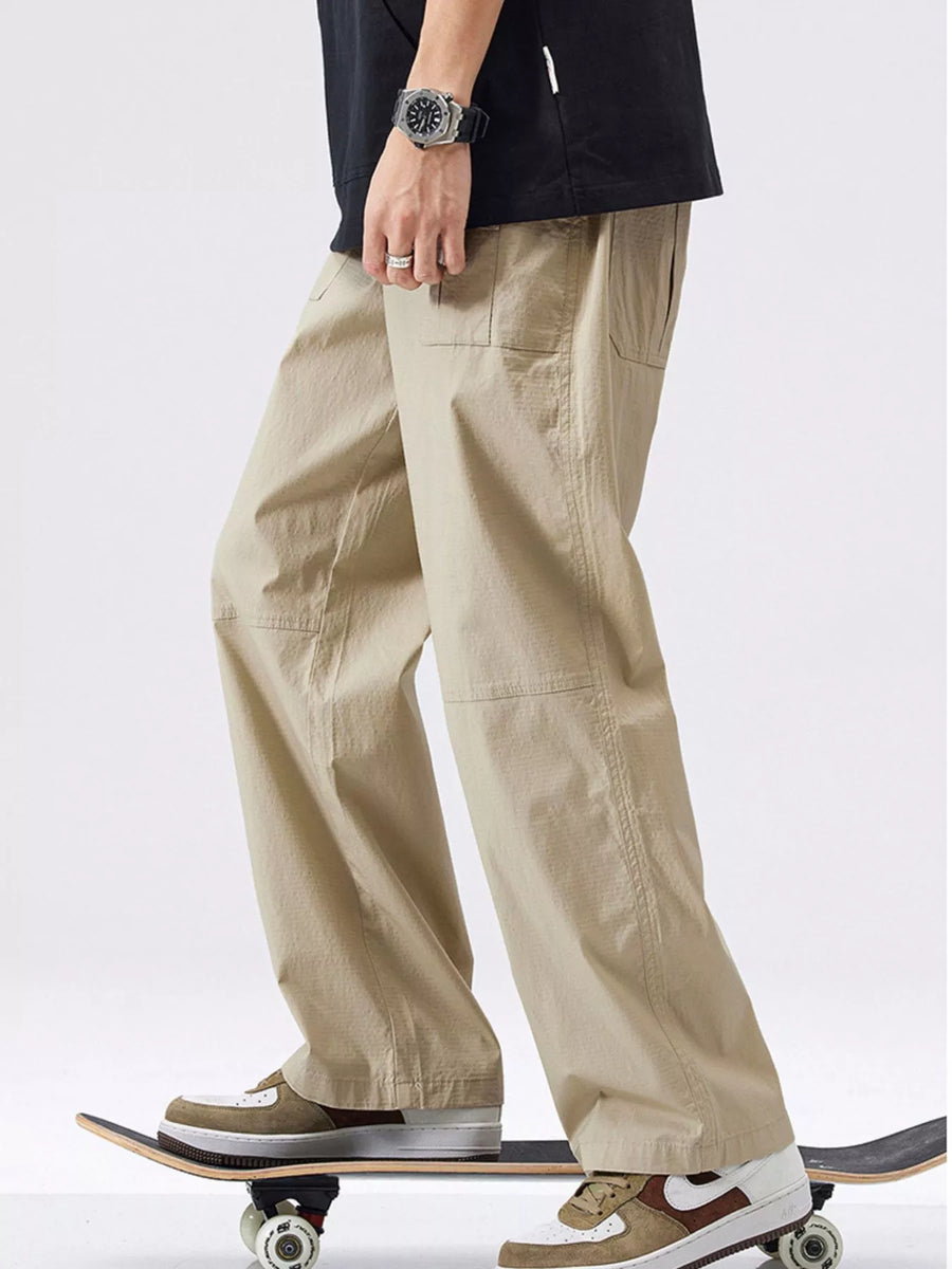 Khaki relaxed fit cargo trousers with patch pockets and a casual style.