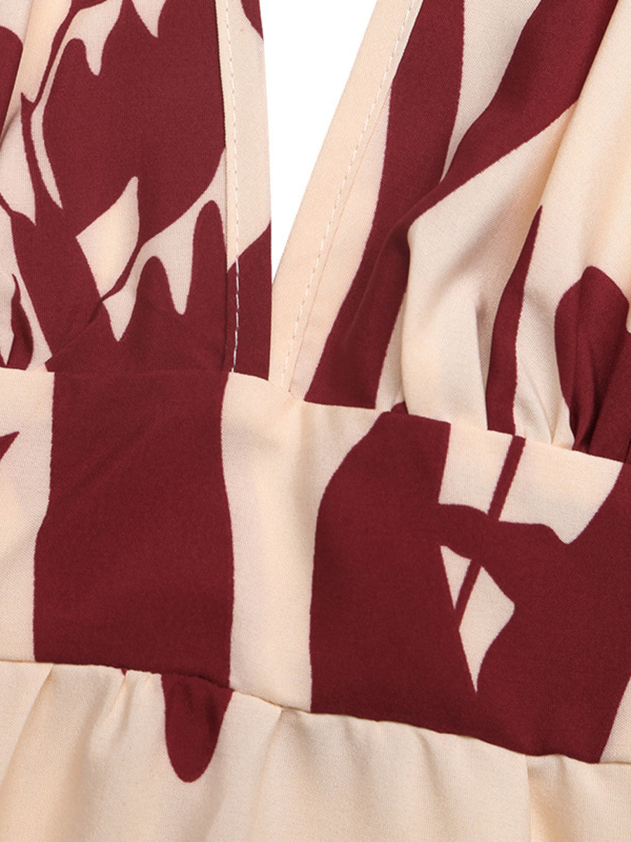 Maxi dress with deep V-neck and bold floral print in cream and burgundy.