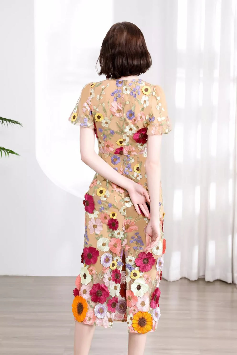 Sheer floral embroidered midi dress with short sleeves and a slit hem.