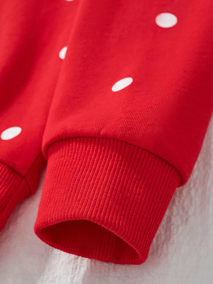 Red cotton polka dot sweatshirt with ribbed cuffs.