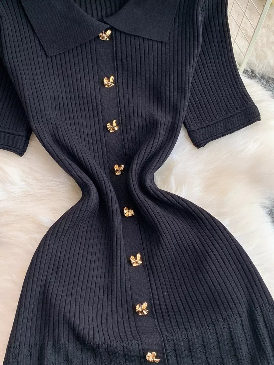 Black ribbed knit midi dress with collar and gold button detail