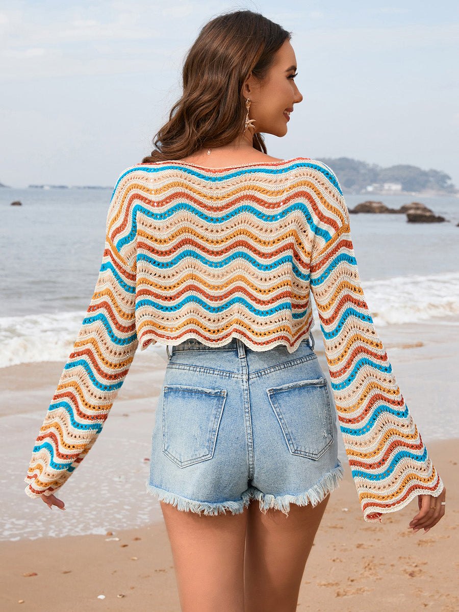 Cropped crochet sweater with multicolor wave stripes and open knit detail.