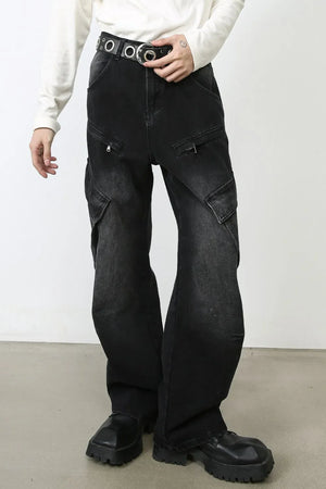 Faded black denim utility cargo pants with multiple zip pockets and a wide leg.