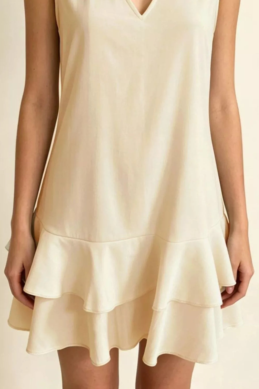 Beige V-neck mini dress with tiered ruffle hem, sleeveless, polyester
