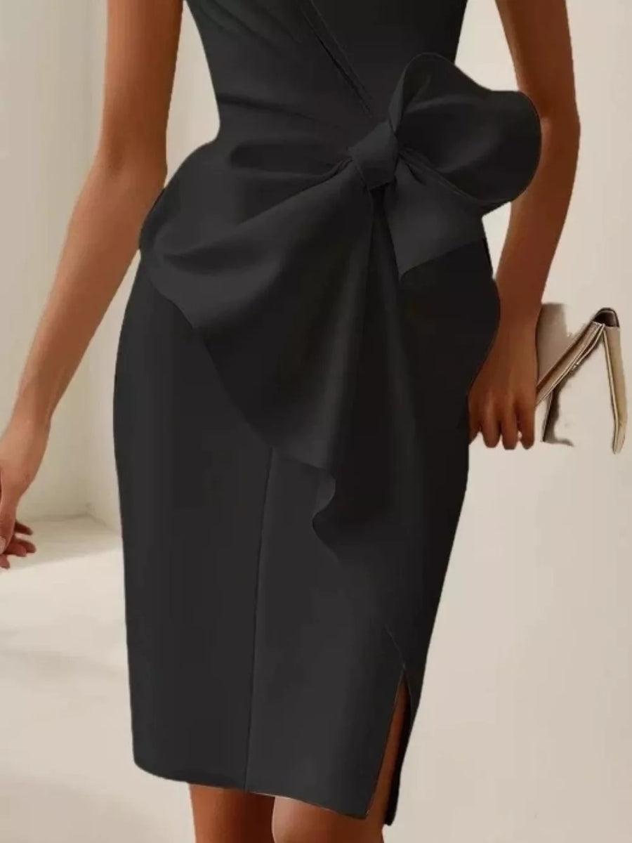 Black sleeveless dress with a large bow detail and side slit