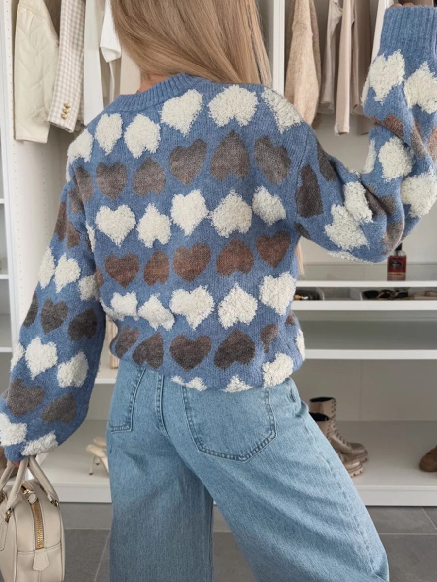pullover sweater featuring heart-print in charcoal with 100% polyester Care instructions: Machine wash cold texture
