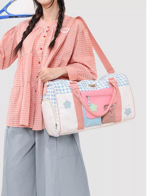 Charming Color Block Travel Bag with blue gingham, pink, and white star pattern, adjustable straps.