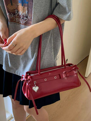 Red PU leather shoulder bag with silver heart charm and bow details