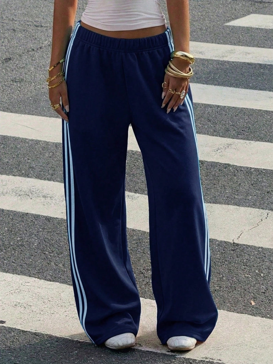 track pants in Black with high-waisted and full-length