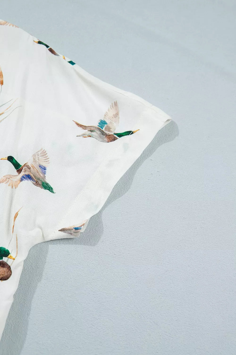 cream button-up shirt