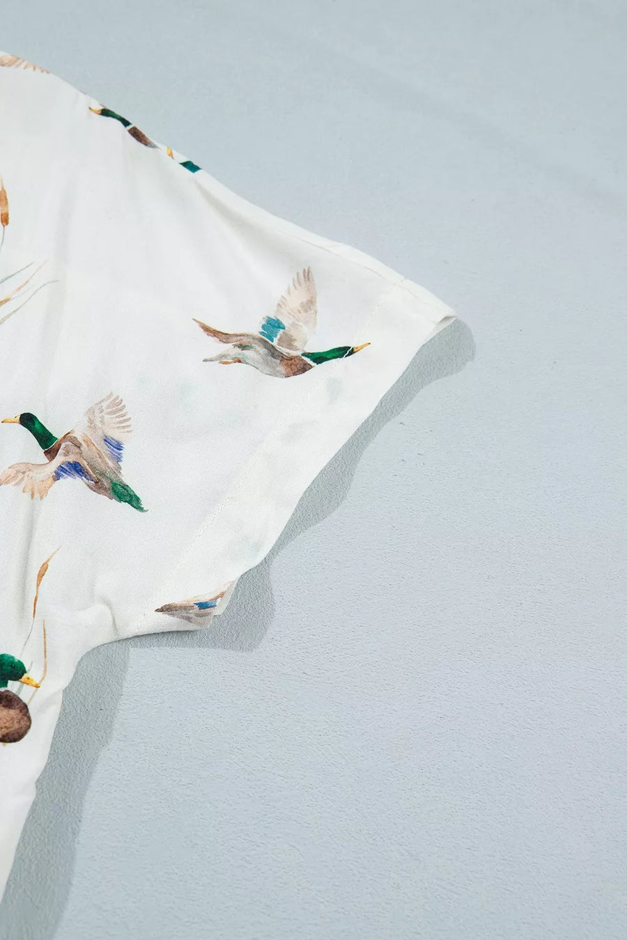 cream button-up shirt