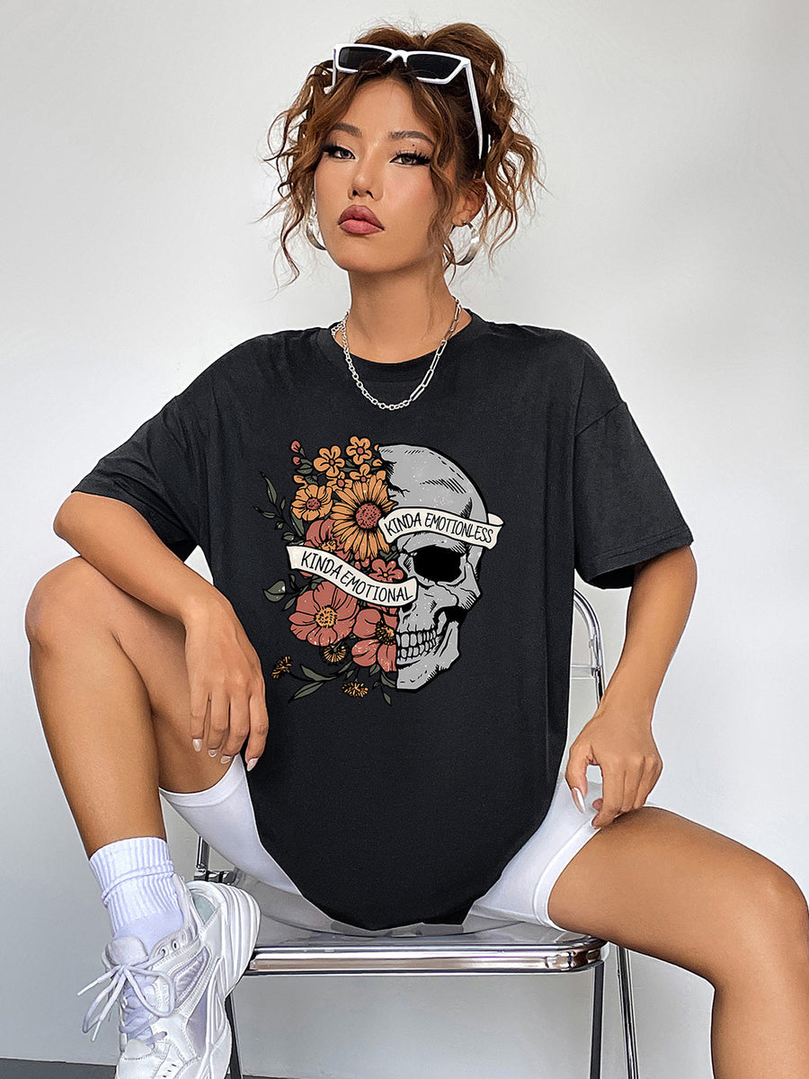 Black oversized tee with skull and floral graphic, "Kinda Emotional" text