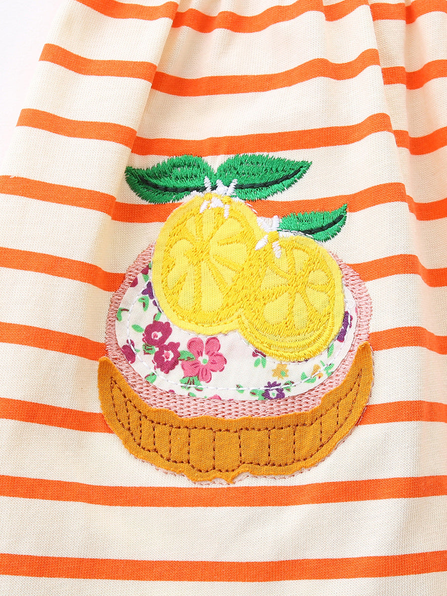 Embroidered cupcake dress with lemon slices and floral applique on orange striped cotton.