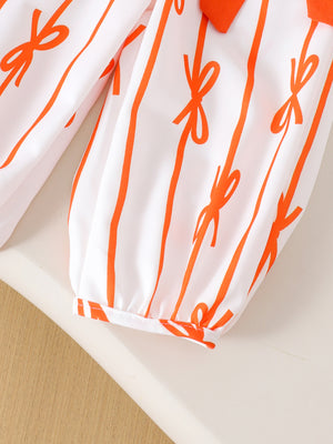 Baby top and pants set with orange bow stripe pattern and ankle cuffs.