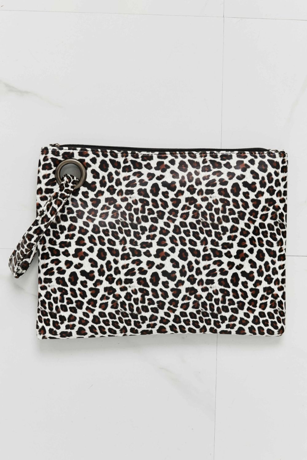 Leopard print clutch bag with wristlet strap and metal ring detail