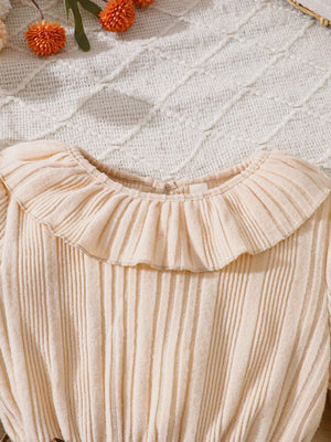 Apricot baby dress with ruffle collar and ribbed texture
