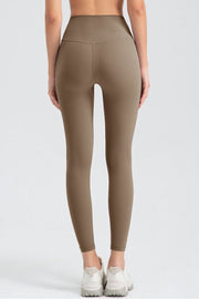 Khaki high-waist performance leggings with sculpted seam detail.
