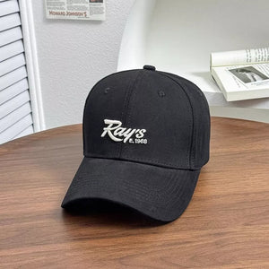 Black baseball cap with white embroidered "Ray's E. 1968" logo detail.