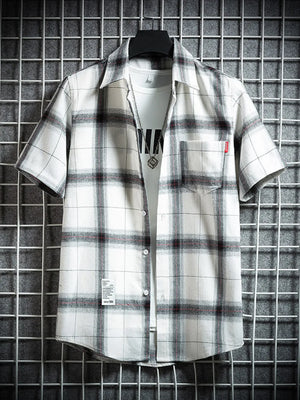 Classic plaid short-sleeve men's cotton shirt in white with black and red checks, featuring a chest pocket.