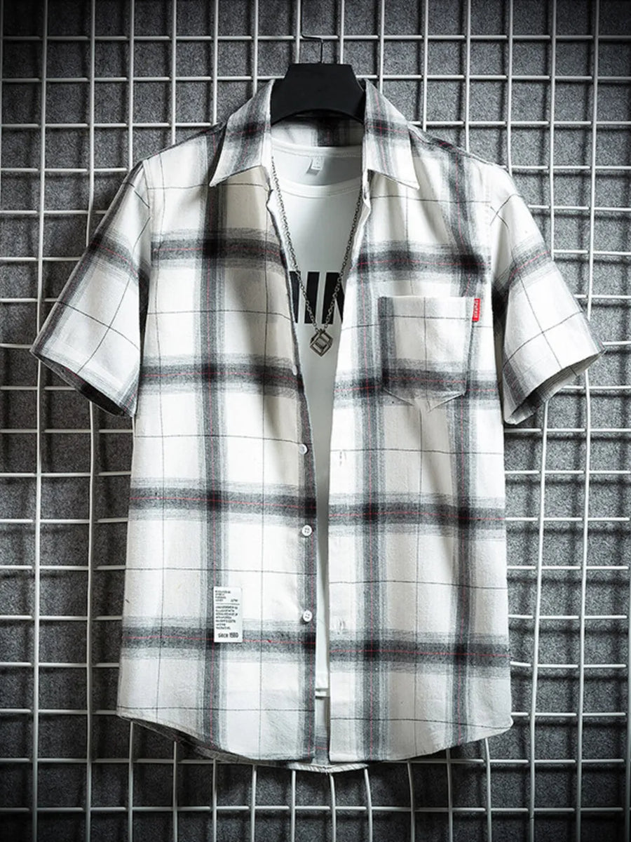 Classic plaid short-sleeve men's cotton shirt in white with black and red checks, featuring a chest pocket.