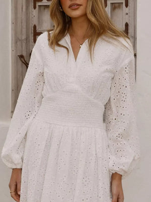 White eyelet balloon sleeve mini dress with smocked waist and v-neck