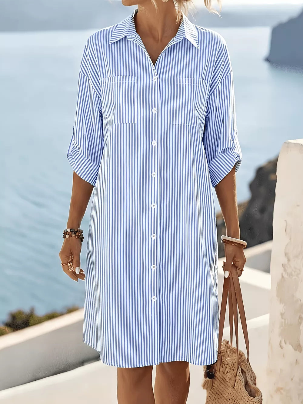 white shirt dress featuring buttoned and striped