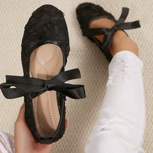 shoes in white with floral and bow detail