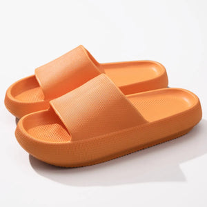 Textured cloud slides slippers in apricot with a ribbed strap and thick sole.