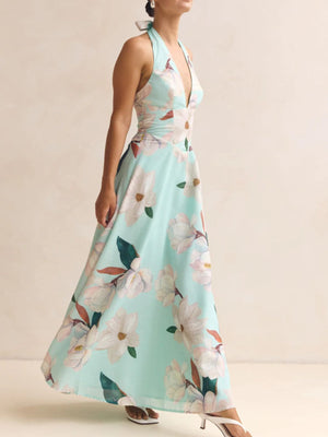 Blue floral halter neck maxi dress with a plunging neckline and a-line skirt.