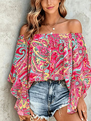 off-shoulder top in Blue with feather-print and smocked