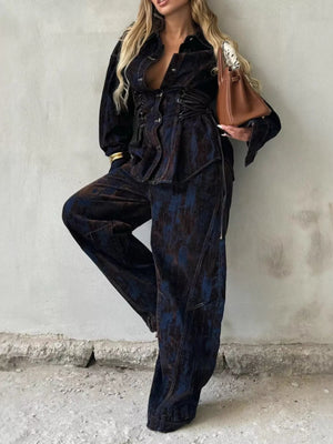 Denim jacket and pants set in dark blue with lace-up detail and abstract pattern.