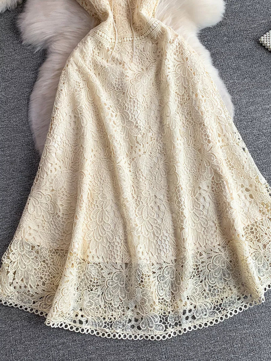 Cream floral lace A-line dress with tie detail and scalloped hem.