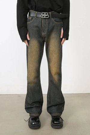 Faded wash bootcut jeans in olive brown with dip dye effect.