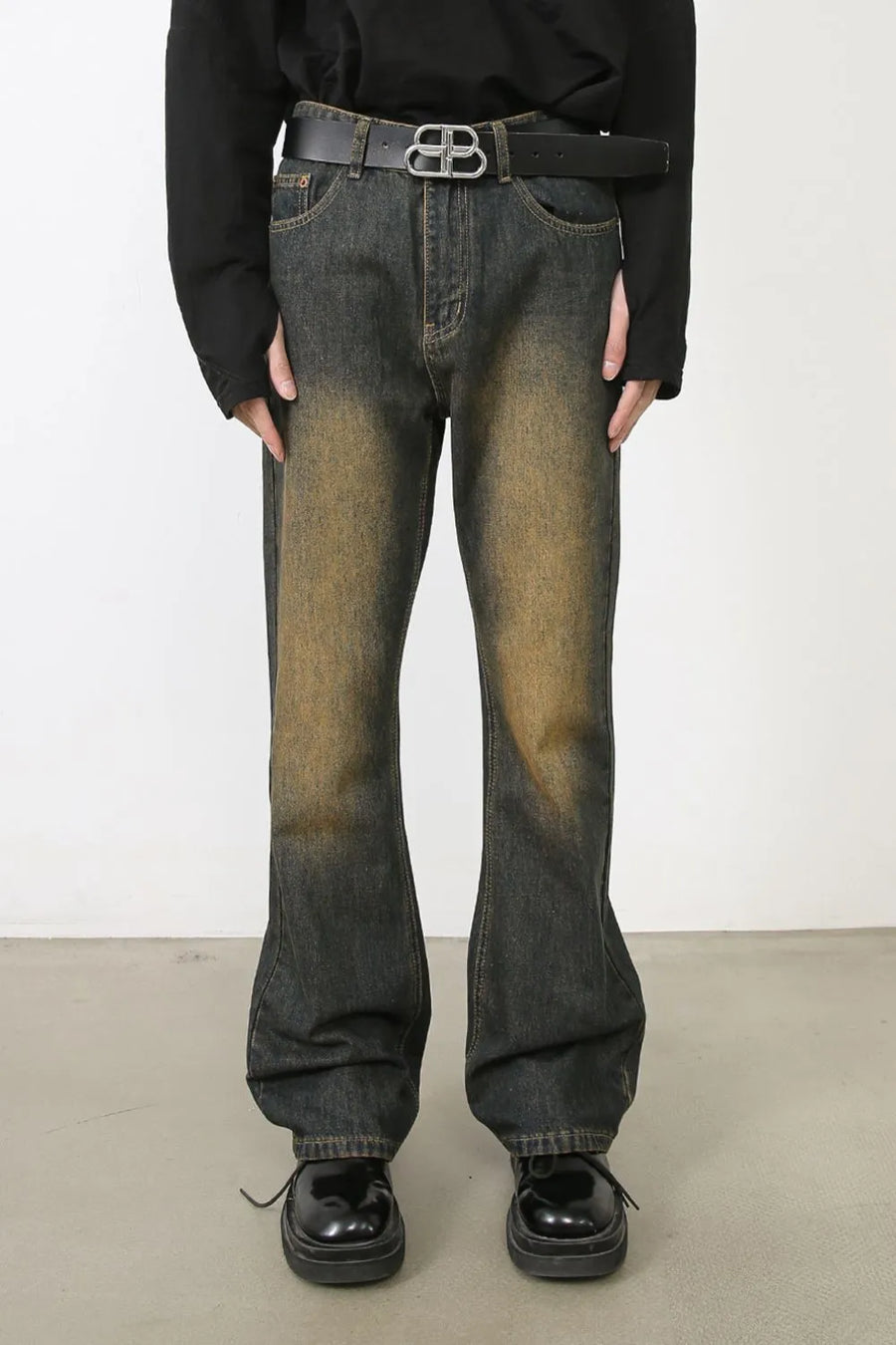Faded wash bootcut jeans in olive brown with dip dye effect.