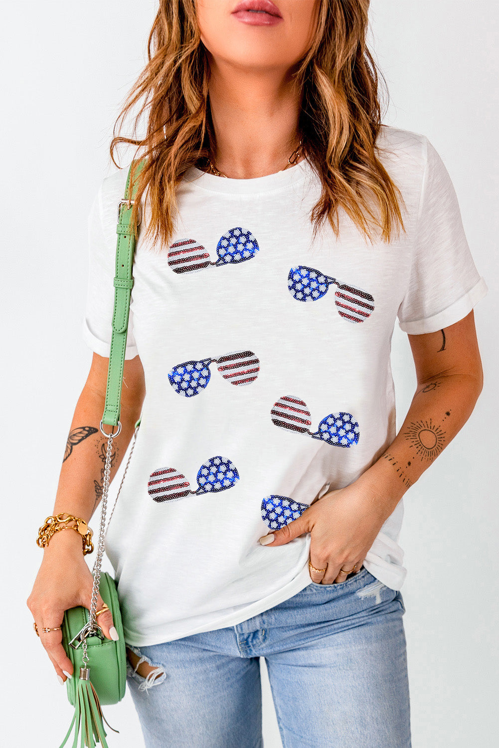 White t-shirt with sequin American flag sunglasses graphic, crew neck, short sleeves.