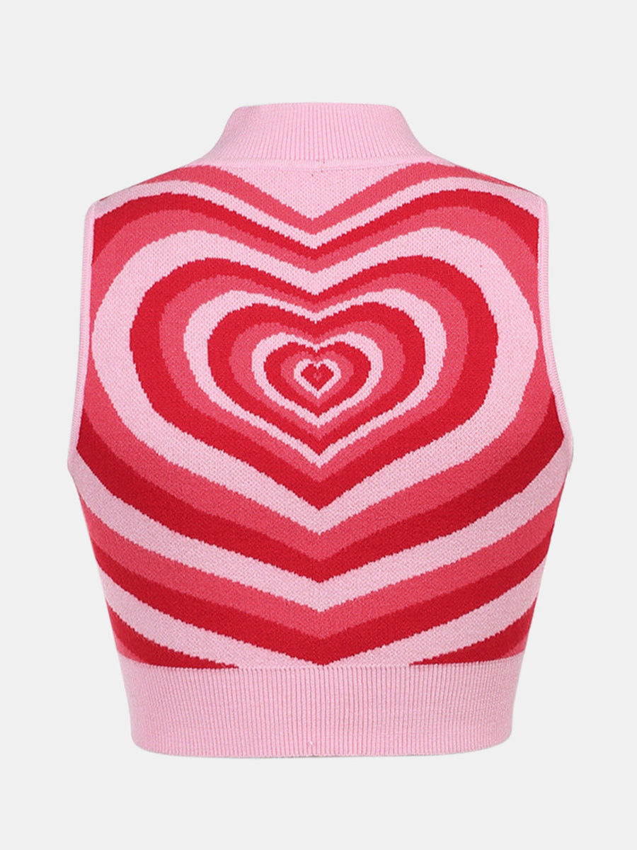 Pink knit tank top with concentric heart intarsia pattern in shades of red and pink.