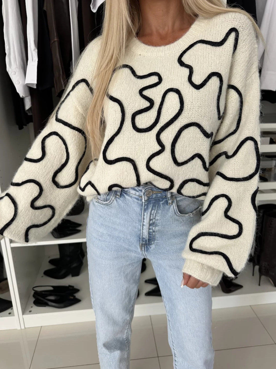 100% polyester Care instructions: Machine wash cold pullover sweater in White with oversized silhouette
