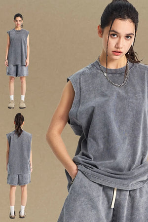 Acid wash relaxed fit tank top in dark gray with a crew neck and sleeveless cut.