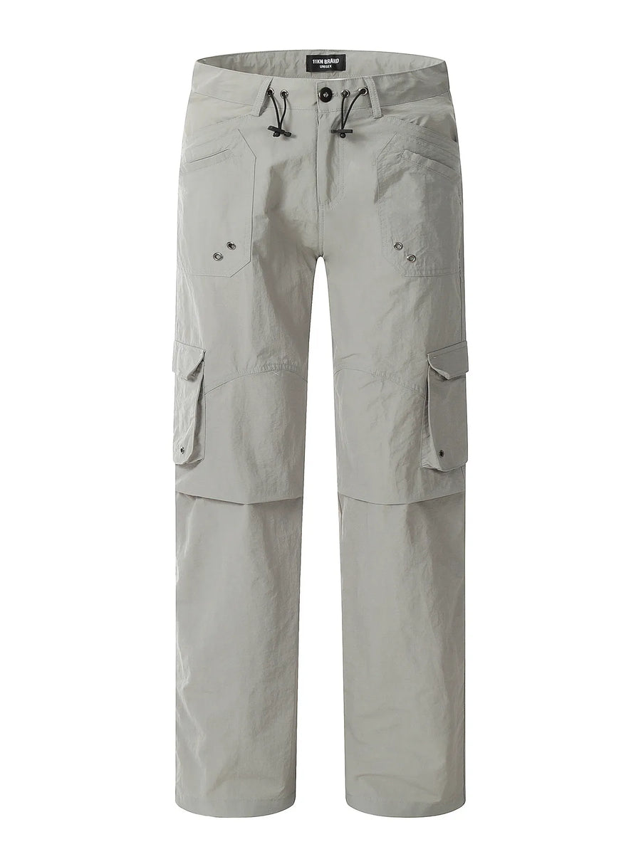 Grey relaxed fit utility cargo pants with multiple pockets and drawstring waist.