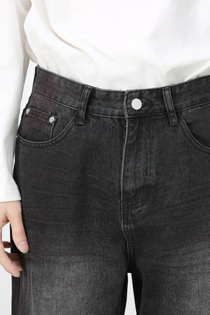 Faded dark wide-leg denim jeans with button fly and five-pocket styling.