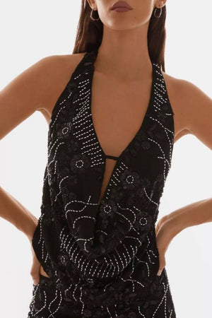 Black halter neck mini dress with white embroidery and sequin embellishments